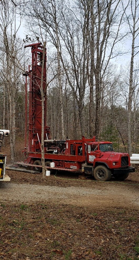 Drilling machine installed on the old truck.